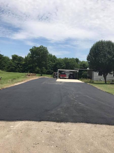 We added an extra level of asphalt to this driveway to expand it for more parking! 